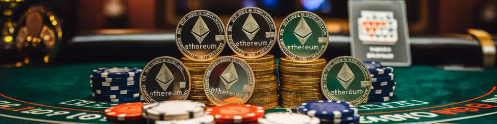 tacks of Ethereum coins and poker chips on a casino table.