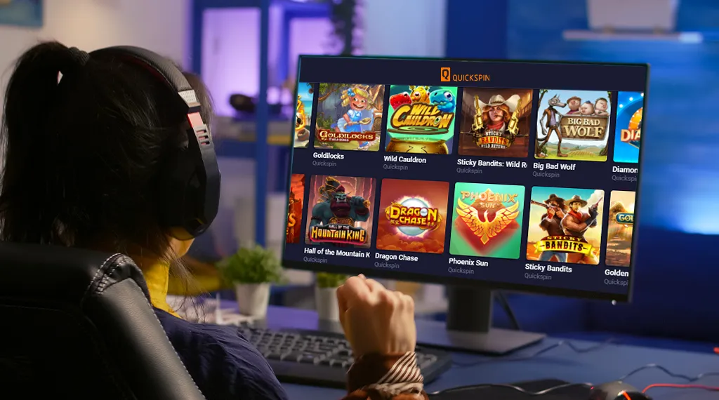 Gamer playing Quickspin slots on a computer screen, featuring popular slot titles.