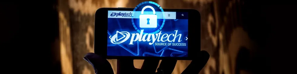 A hand holding a smartphone displaying Playtech's logo with a security lock overlay, symbolizing safe and secure mobile casino gaming.