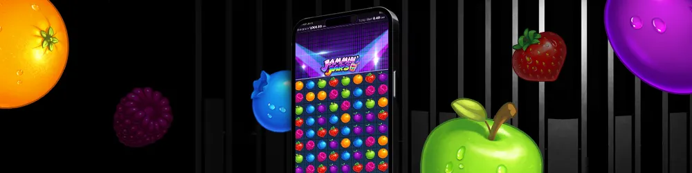 A phone displaying the Jammin' Jars slot game with colorful fruits like apples, oranges, and berries on the screen, set against a dark background with additional fruit elements floating around.