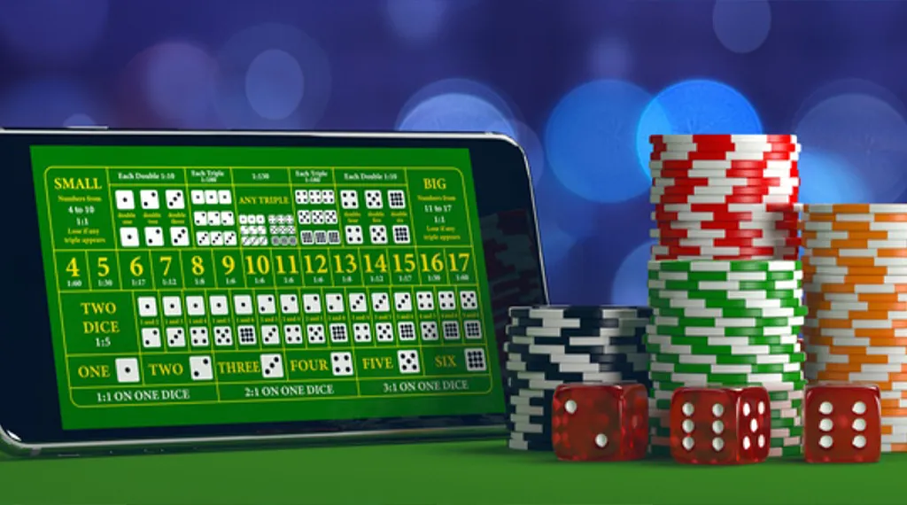 Mobile phone screen displaying a Sic Bo betting table with colorful chips and dice.