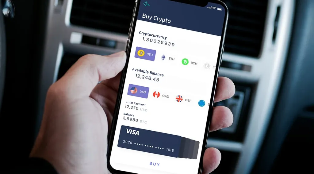 A person examines currency values while holding their phone in hand.