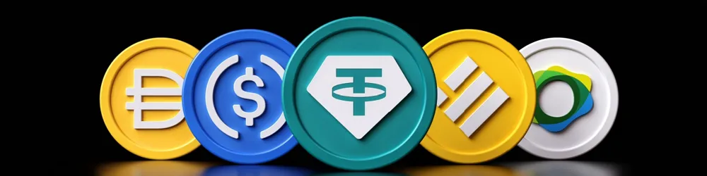 Four coins in different colors are lined up in a row, showcasing a variety of hues and designs.