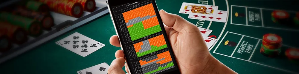 スマートフォンでバカラのゲーム結果を確認する手元の画像。